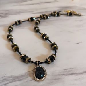 2/23/23 - black and gold crystal like necklace